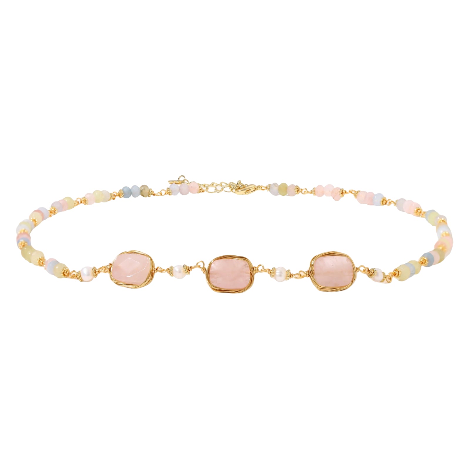 Gold necklace with three rose quartz stones, multicolor pastel beads, and pearl accents on white background.
