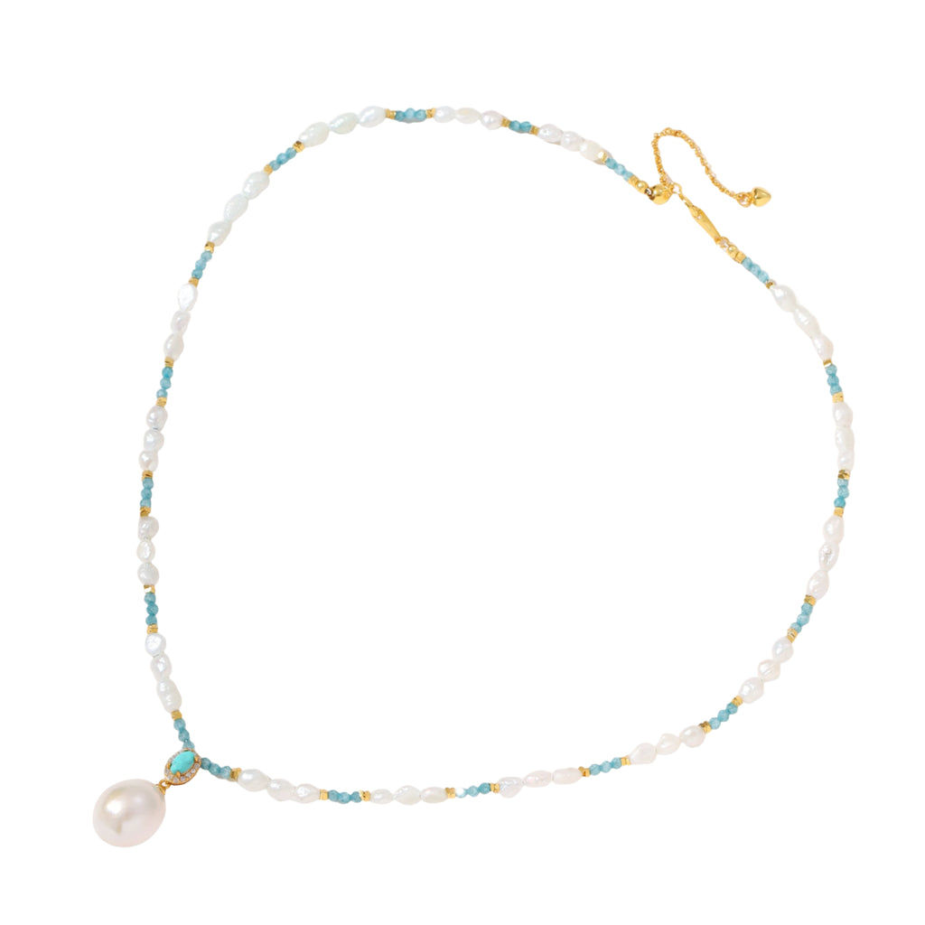 Beaded necklace with baroque pearls, turquoise stones, and gold accents featuring a large pearl pendant on white background.