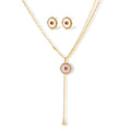 Gold-plated circular medallion necklace set with white enamel base and pink cubic zirconia accent stones